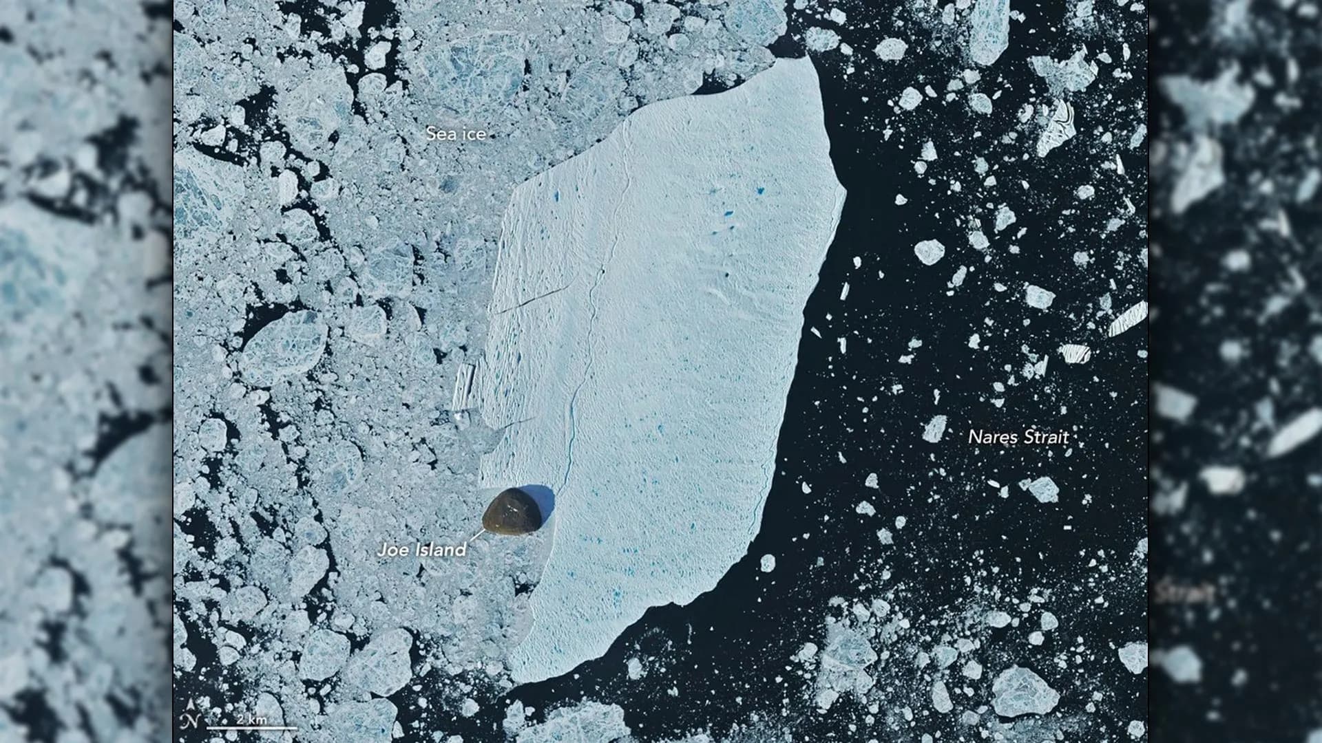 Giant Greenland iceberg slams into Joe Island and survives